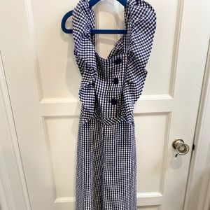 Navy blue and white checkered jumper.